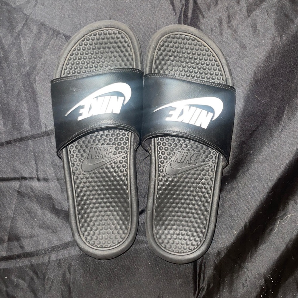 Fairly new, Nike black slip ons/slides w/ white logo. Size 11 US men’s.